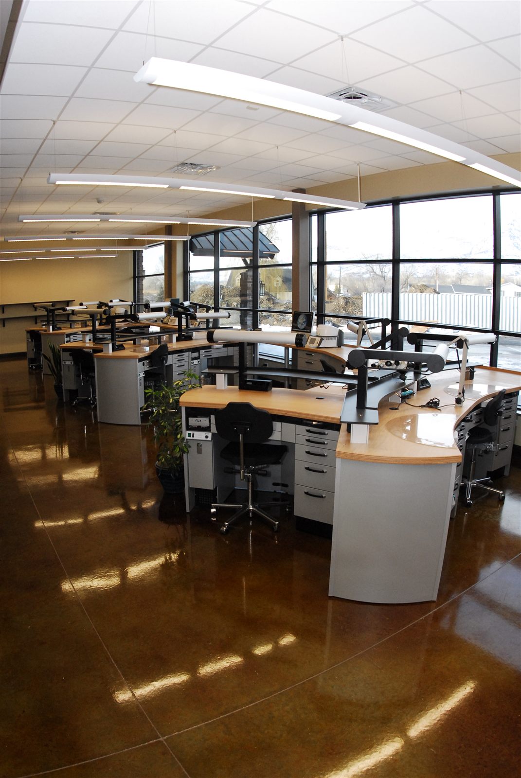 Technician workstations along the windows at Experience Dental Studio